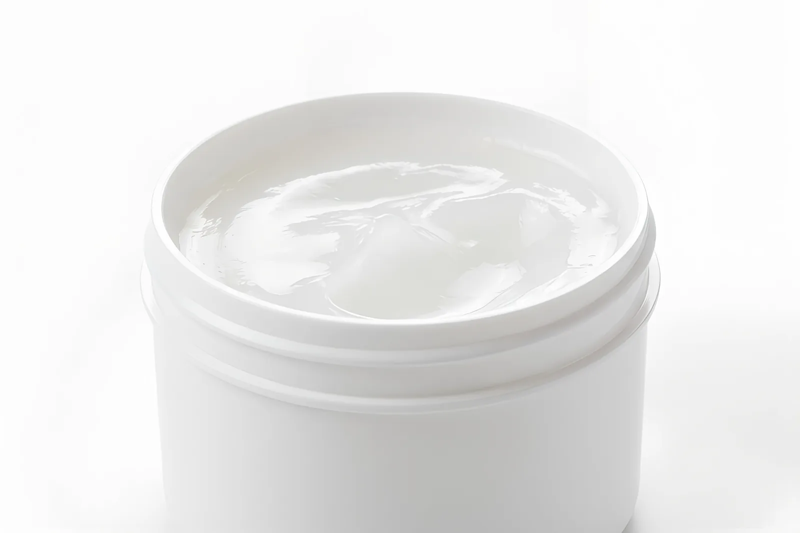 BHD Chemical white petroleum jelly in an open white plastic container, showing its smooth, viscous semi-solid texture.